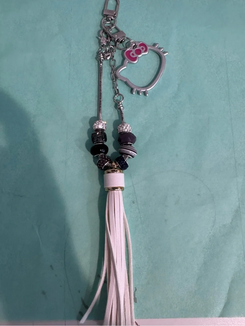 Hello Kitty Silver Keychain with Pink Bow Accent and White Tassel